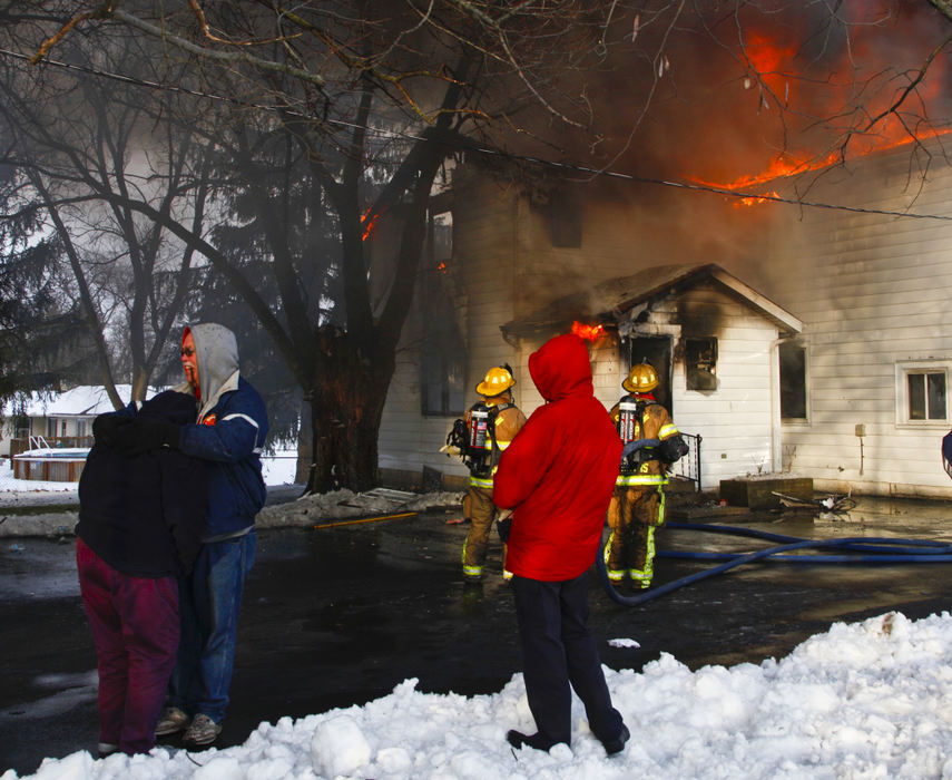 Spot News - 2nd placeGerman Township fire fighters battled a house fire on Troy Road. The fire started as the result of unattended food on a stove, according to Fire Chief Tim Holman, with flames fanned by open windows. All residents of the home including renters of an attached apartment vacated safely but the house will most likely be declared a total loss. (Barbara J. Perenic / Springfield News-Sun)