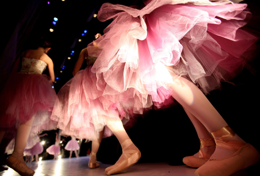 Feature - 2nd place Ballerinas, dressed as "flowers" start to run onstage for the Waltz of the Flowers scene during dress rehearsal for Ohio Dance Theatre's "The Nutcracker" at the Stocker Arts Center at Lorain County Community College in Elyria.  (Lisa DeJong / The Plain Dealer)