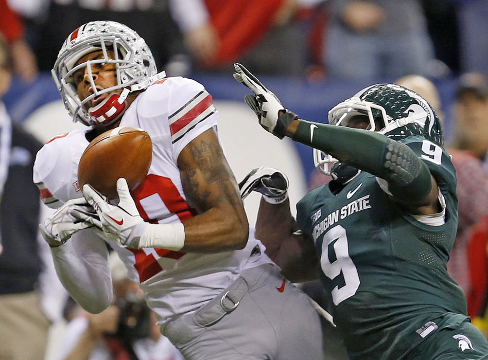 Sports - 1st placeOhio State wide receiver Philly Brown (10) can't make the catch against Michigan State Spartans safety Isaiah Lewis (9) during the first half of the Big Ten Championship game at Lucas Oil Stadium in Indianapolis. (Jonathan Quilter / The Columbus Dispatch)