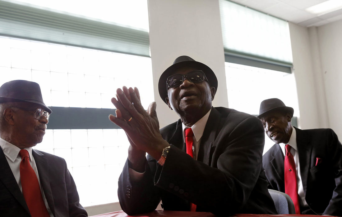 Story - 2nd place(From left) Willie Russell, Clyde Williams and Cecil Howard wait for the start of the program during the Holiday Celebration at the Marion Franklin Recreation Center in Columbus. The men are members of the "Men in Black" performance group, an all-male, synchronized dance team for senior citizens who meet twice a week at the rec center to practice. The group was performing as part of the program, they specialize in a form of line dancing that is low impact. The oldest member of the group is 87 years old. (Brooke LaValley / The Columbus Dispatch)