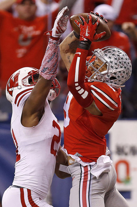 Story - 2nd place - Ohio State wide receiver Devin Smith (9) makes a touchdown catch over Wisconsin cornerback Peniel Jean in the third quarter. (Jonathan Quilter / The Columbus Dispatch )