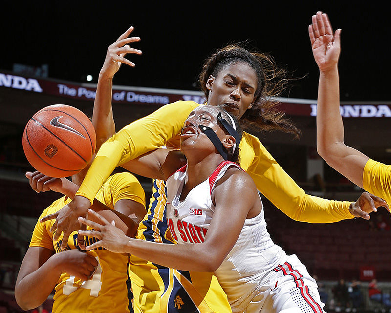 sSports - HM - North Carolina A&T's Courtney Powell (32) fouls Ohio State guard Kelsey Mitchell (3) as she goes to the basket at Value City Arena.  (Chris Russell / The Columbus Dispatch)