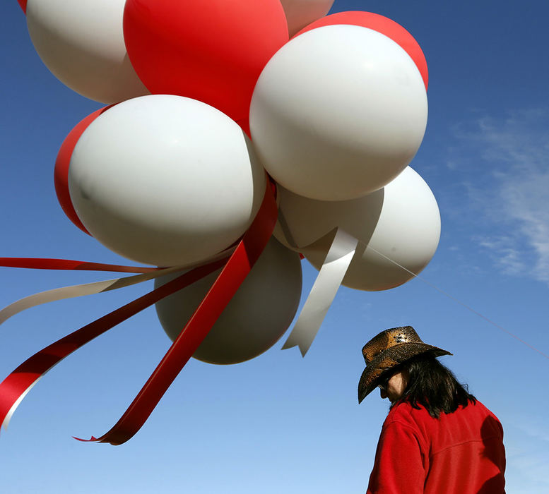 Feature - HM - Amanda Lane, a 2006 Ohio State finance graduate now living in Nevada, attends the Buckeye Bash pep rally at WestWorld in Glendale, AZ. in anticipation of Saturday's Fiesta Bowl between the Buckeyes and the Clemson Tigers.  (Barbara J. Perenic / The Columbus Dispatch)