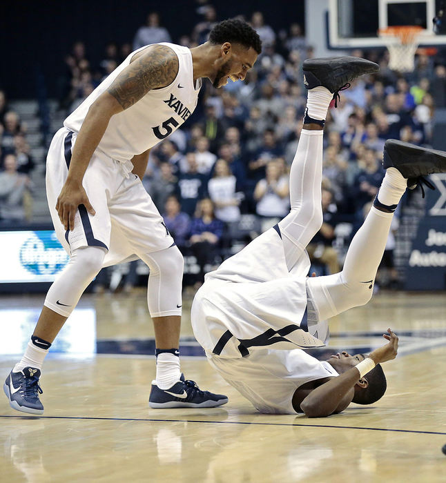 SSports Feature - 1st place - Xavier guard Trevon Bluiett (5) smiles and cheers to Edmond Sumner (4) as he rolls away after making a shot and being fouled for an and-one in the second half of the Big East Conference game against the Providence Friars. (Sam Greene / Cincinnati Enquirer)