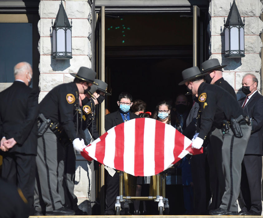 General News - 2nd place - Family members watch as the Mercer County Sheriff's olor guard drapes the flag over the casket of Mark Heinl at Holy Trinity Catholic Church in Coldwater. Daniel Melograna / The Daily Standard