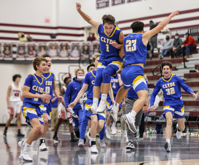 Sports Feature - 2nd place - Clyde’s Jaden Cook (1) and Caden Berger (23) celebrate  defeating Cardinal Stritch, 52-51, during the Bulldog Basketball Holiday Tournament in Rossford. Berger hit a three-point-basket at the buzzer to win the game for the Fliers.  Jeremy Wadsworth / The Blade