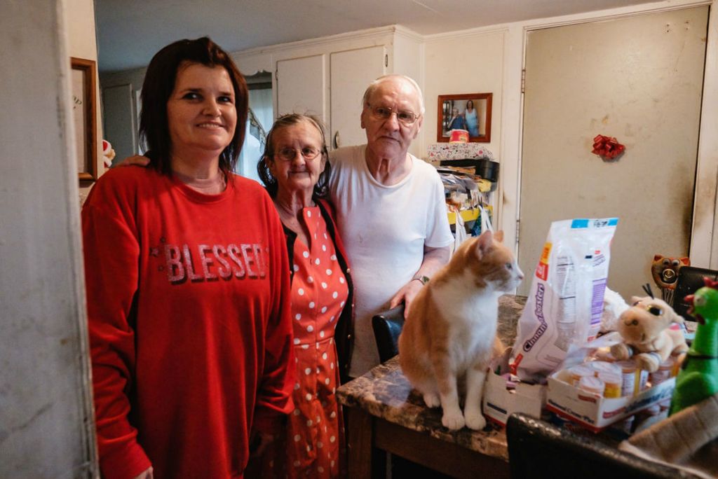 Portrait - HM - Michelle Lea Todd (left) poses for a portrait with Helen Hardy and her husband William in the Hardy residence in Uhrichsville. Todd is a carrier for the Times-Reporter and received a tip from a customer on Thanksgiving which she in turn used to purchase Thanksgiving dinner for the Hardys. (Andrew Dolph / The Times Reporter) 