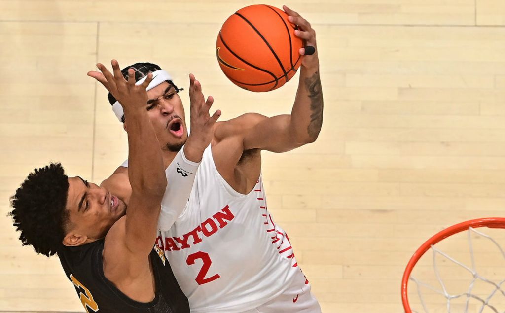 Sports - HM - Dayton's Toumani Camara takes the ball to the hoop against Jordan O'neal of Alabama State. Dayton defeated Alabama State 93-54 at UD Arena. (Erik Schelkun / Elsestar Images) 