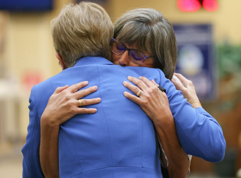 General News - 1st place - Susan Zeier, mother-in-law of the late Sgt. First Class Heath Robinson, facing camera, hugs U.S. Rep. Marcy Kaptur during a press conference about the recently-passed Sgt. First Class Heath Robinson Honoring our Promise to Address Comprehensive Toxics (PACT) Act at the Toledo VA Clinic. Robinson, an Ohio National Guardsman, died in 2020 from lung cancer after exposure to burn pits during deployment in Iraq. The act is meant to expand VA benefits for veterans exposed to burn pits and other toxins during their military service.  (Kurt Steiss / The Blade)