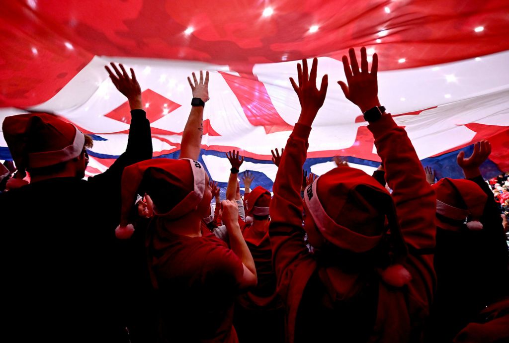 Sports Feature - 2nd place - A giant Red Scare banner is passed over the student section before tip off of the Dayton vs UNC Asheville basketball game at UD Arena.  (Erik Schelkun / Elsestar Images)