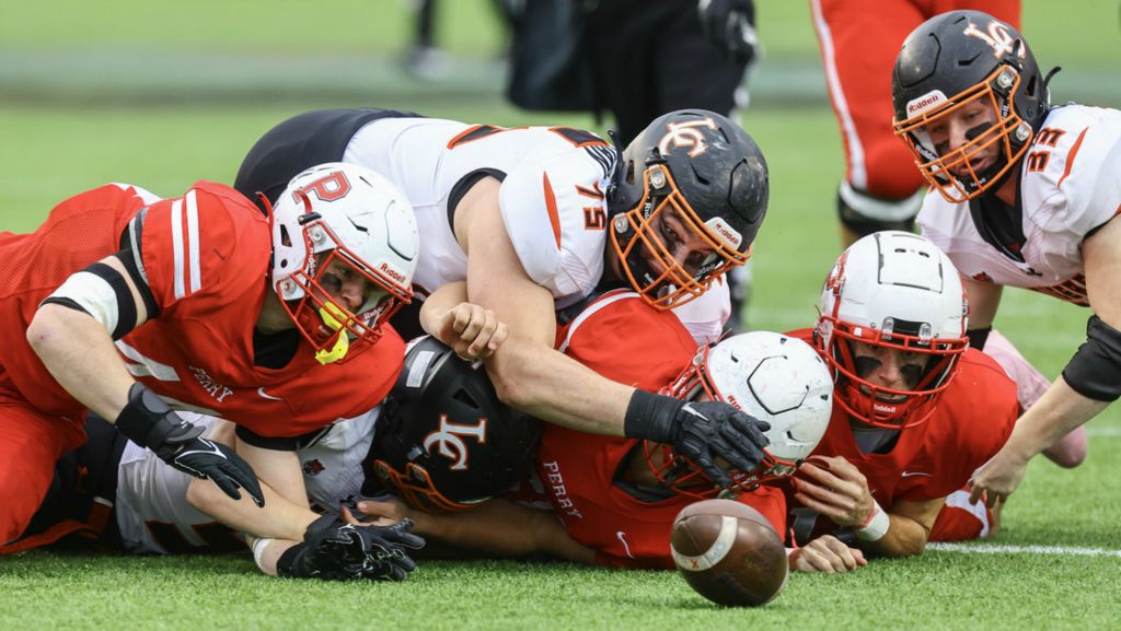 Sports - 1st place - Liberty Center defensive lineman Landon Bockelman (75) chases a Perry fumble during the Division V state championship game at Tom Benson Hall of Fame Stadium in Canton.  (Jeremy Wadsworth / The Blade)