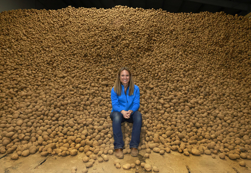 Portrait - 1st place - Fourth generation potato farmer, Kathy Sponheim, has a lot of spuds at Michael Family Farms in Champaign County. Kathy's family supplies potatoes to the great lakes region of the country.  (Bill Lackey / Springfield News-Sun)