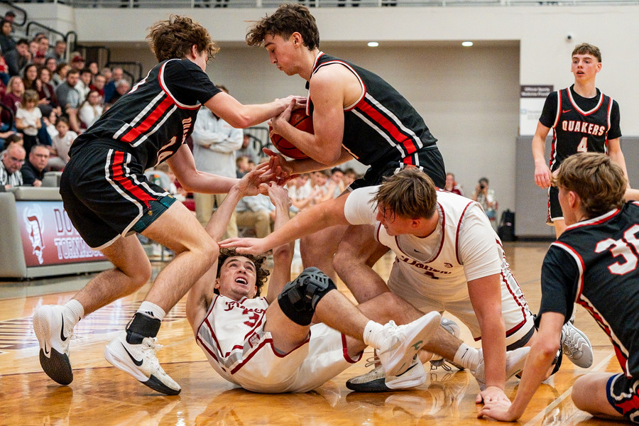 Sports - 3rd place - Dover’s Nathan Leggett (on ground) is stripped of possession during the annual Dover-Phila basketball game at Dover High School. (Andrew Dolph / The Times Reporter)