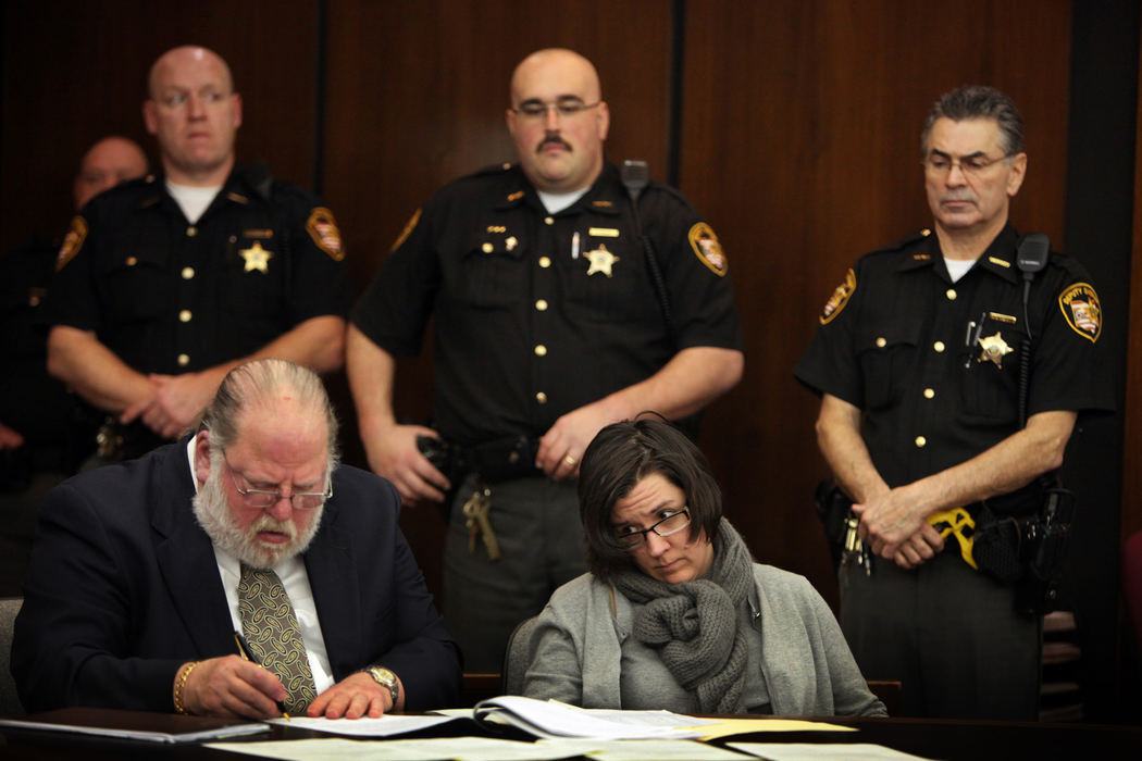 General News - 3rd place - Franklin County Sheriff Deputies (from left) Mark Green, Dave Bryant and Charlie Macioci guard attorney Robert M. Sanders and Gianna Cochran, as Franklin County Common Pleas Court Judge David E. Cain reads off numerous guilty verdicts during a bench trial. (Tom Dodge / The Columbus Dispatch)