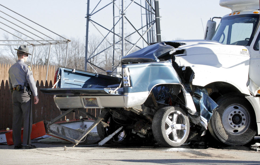 Spot News - 3rd place - The State Highway Patrol investigates a fatal head-on collision between a north-bound semi truck and a south-bound GMC pickup truck on St. Rt. 68 just south of Urbana.  (Barbara J. Perenic / Springfield News-Sun)