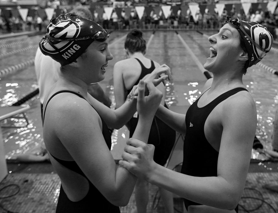 Story - 1st place - Granville's Sydney King (left) celebrates with teammate Alex Untied, after finishing in second place in the 400 yard freestyle relay and clinching second place overall in the 2011 Division II Ohio State High School Swimming Championship at C.T. Branin Natatorium in Canton. (Kyle Robertson / The Columbus Dispatch)