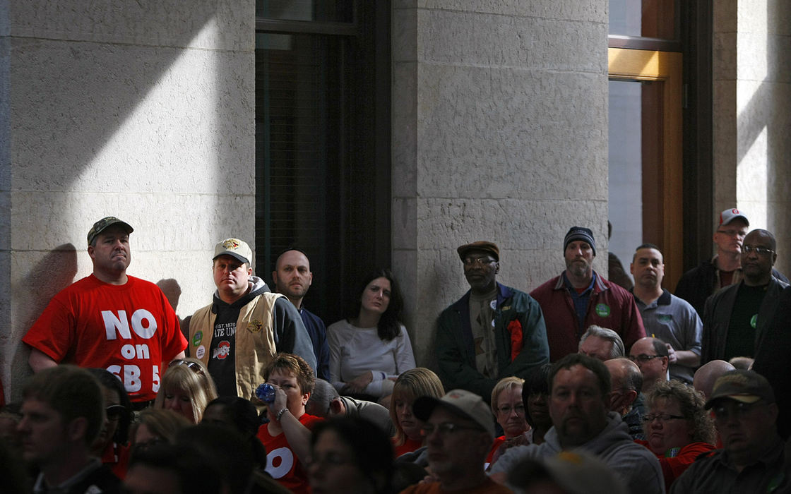 Story - 2nd place - Opponents of Senate Bill 5 assemble in the atrium to listen to the proceedings over the speaker system at the Statehouse. (Jonathan Quilter / The Columbus Dispatch)