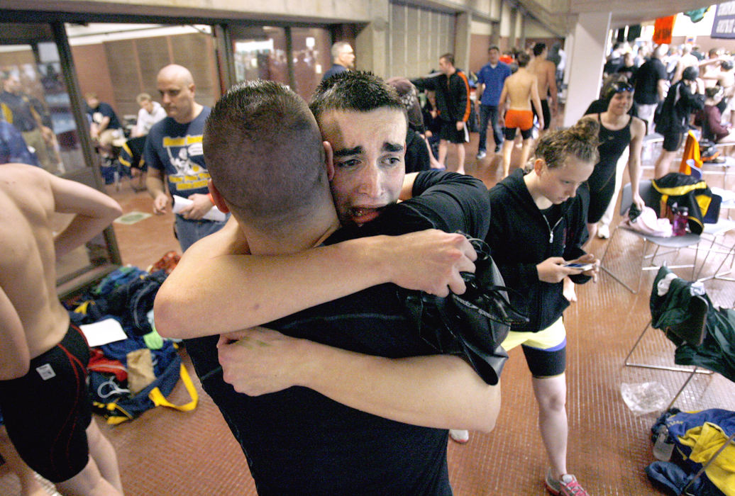 Sports Feature - 2nd placeHoover's Stephen Watson (left) is  congratulated by head coach Matt Johnsen on the pool deck after Watson took first place in the 50 yard freestyle during the Division I district swim meet at Cleveland State University. (Scott Heckel / The (Canton) Repository)