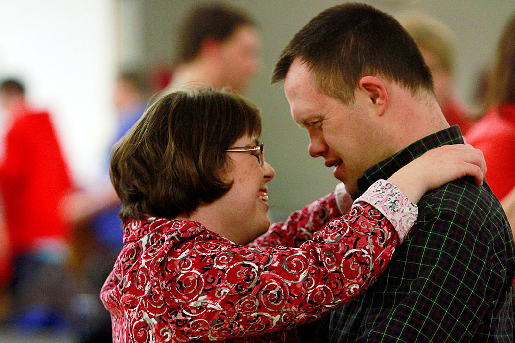 Story - 3rd place - Amanda Morrow and Joe Skully laugh as they dance during the Special Needs Valentines Day Dance at the Westerville Recreation Center.  This is just one of many activities offered through the Access to Recreation Program (Lorrie Cecil / ThisWeek Community News)