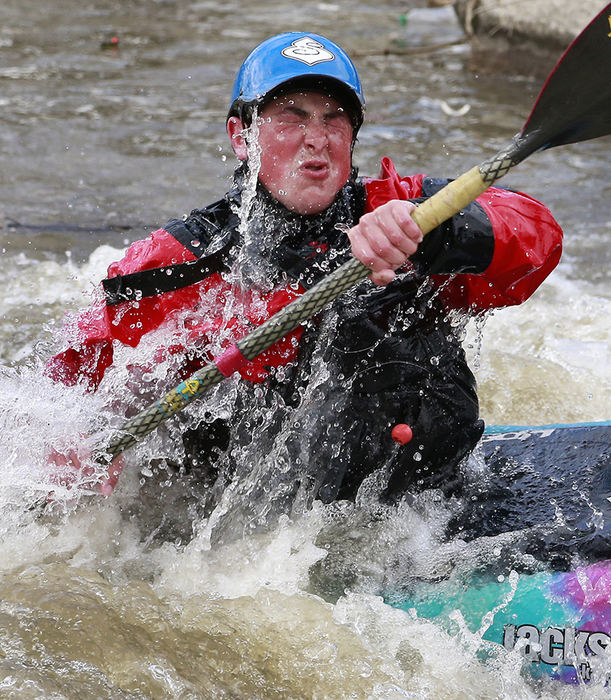 Sports - 2nd place - Dylan Isaacs of Kettering, grimaces as he comes up out of the freezing water in his kayak at the white water feature along Buck Creek.  (Bill Lackey / Springfield News-Sun)