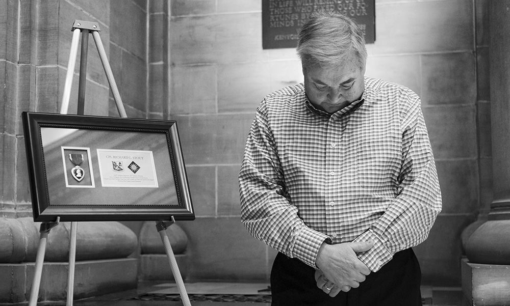    General News - 2nd place - Ron Stout bows his head in a moment of silence after receiving his uncle's lost Purple Heart during a ceremony at  the Rutherford B. Hayes Presidential Library and Museums in Fremont. Cpl. Richard Stout  was killed in action on March 23, 1952, in North Korea. (Jeremy Wadsworth / The Blade)