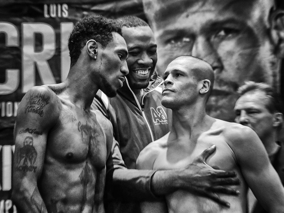 Story - 2nd place - About Billions promoter Ravone Littlejohn separates Robert Easter Jr., Toledo, left, and Luis Cruz, Las Piedras, Puerto Rico, after they weighed in at the Park Inn. The pair were going to fight for Easter Jr.'s IBF World Lightweight boxing title. (Andy Morrison / The Blade)