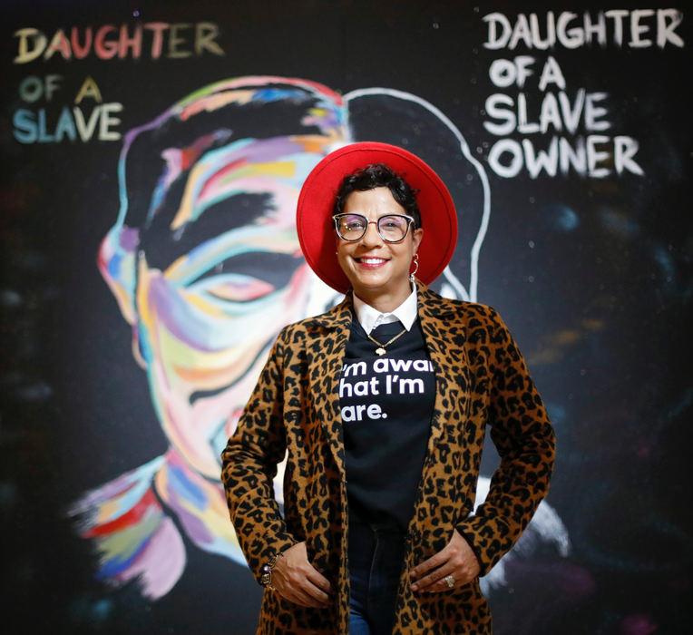 Portrait - 1st place - Visionary Rita Fuller-Yates poses for a photo in front of one of the 8x8 cubes at Easton Town Center in Columbus. Each 8x8 cube appears each week for a total of 4 cubes throughout the month of February. Each cube was designed by local women artists building a story to honor the contributions Black women have made throughout Columbus' enriched history. (Kyle Robertson / The Columbus Dispatch)