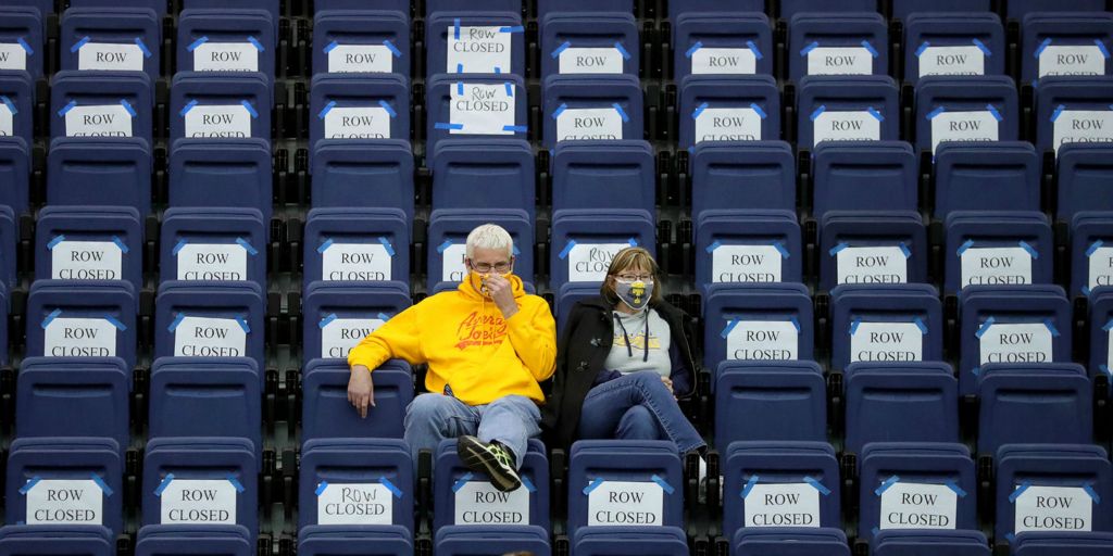 Sports Feature - 3rd place - A pair of Tallmadge fans watch as the Blue Devils take on the Barberton Magics during the second half of a basketball game in Tallmadge. (Jeff Lange / Akron Beacon Journal)