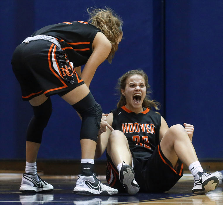 Sports Feature - HM - Hoover's Emily Walker celebrates after a charging foul called against Hoban during the first half of a Division I district final in Akron. (Jeff Lange / Akron Beacon Journal)