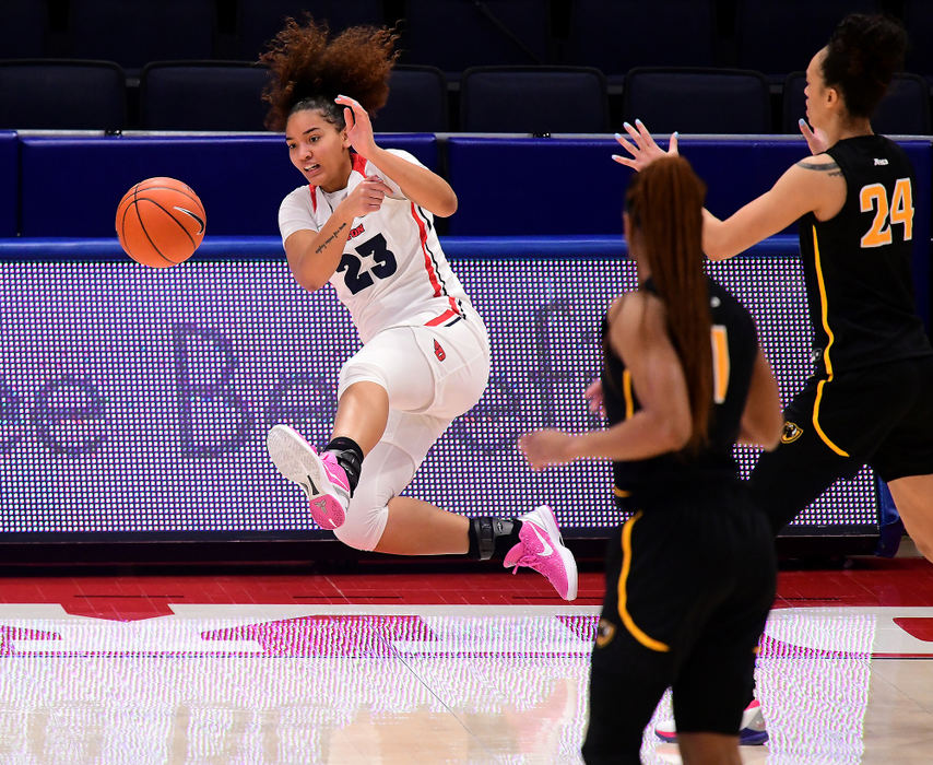 Sports - 3rd place - Dayton's Mariah Perez saves the ball from going out of bounds during the 1st half of action against VCU. Dayton defeated VCU 67-62 at UD Arena in Dayton. (Erik Schelkun / Elsestar Images)