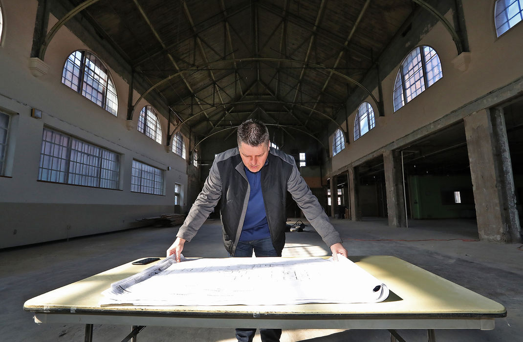 Portrait - 3rd placePatrick Williams looks over plans for the new COhatch Market inside the main hall of the Myers Market building.  (Bill Lackey/Springfield News-Sun)