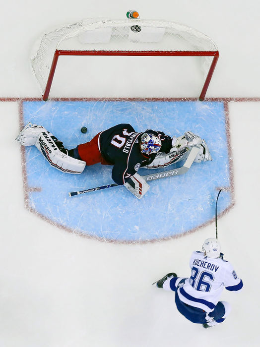 Sports - 3rd placeTampa Bay right wing Nikita Kucherov (86) scores his second goal of the game past Columbus Blue Jackets goaltender Joonas Korpisalo (70) during the first period of a game at Nationwide Arena in Columbus. (Adam Cairns/The Columbus Dispatch)