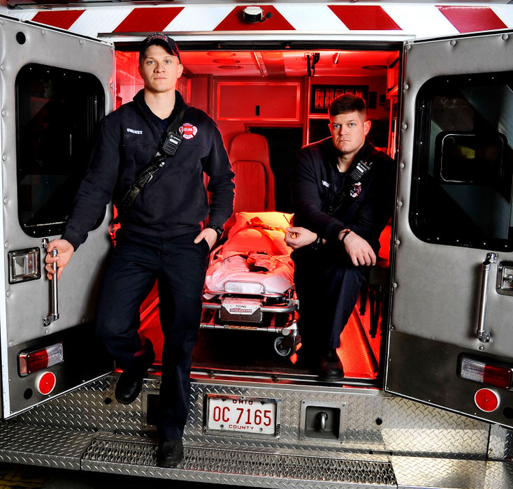 Portrait - 1st place - Celina firefighters/paramedics Kane Swaney (left) and Dane Dwenger pose in one of the ambulances at the Celina Fire Department. Local Emergency Medical Services officials are looking for volunteers to combat a shortage in rural counties.  (Daniel Melograna / The Daily Standard)