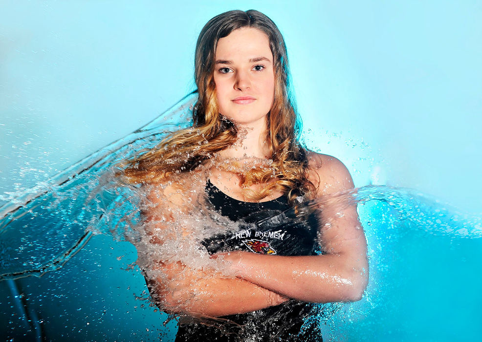 Portrait - 2nd place - New Bremen's Vivian Niekamp prepares to compete in the Division II state diving championship with Kameron MacLean, St. Marys, Holden Cubberley, Celina, and Xander Spees, St. Marys, at the C.T. Banin Natatorium in Canton.  (Daniel Melograna / The Daily Standard)