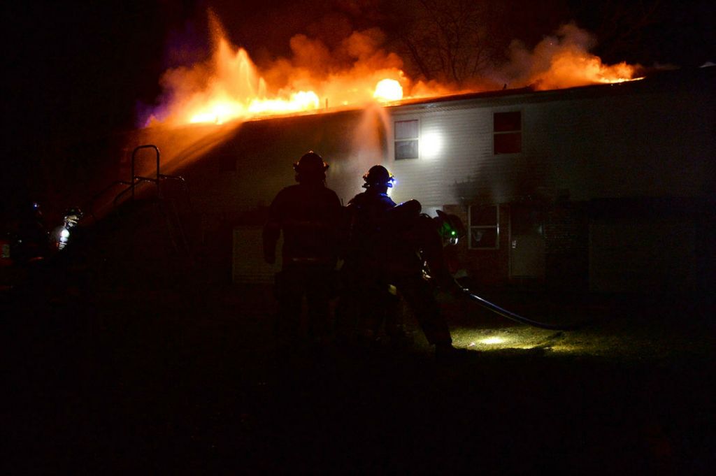 Spot News - HM - Over 30 firefighters from Coldwater, Celina and St. Henry responded to a fire at Greenland Estates apartments at 911 North Seventh St in Coldwater.  (Daniel Melograna / The Daily Standard)