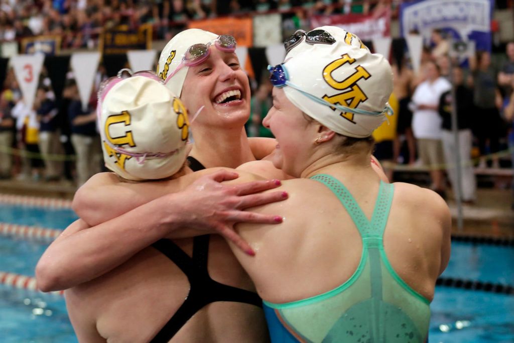 Story - 2nd place - Upper Arlington's Emma Schueler (center) celebrates with teammates Caroline Colombo, Caroline Porterfield and Avery Catalano after the Upper Arlington 200-yard freestyle relay team took first place at the OHSAA Division I state swimming and diving tournament at the C.T. Branin Natatorium in Canton.  (Shane Flanigan / ThisWeek Community News)