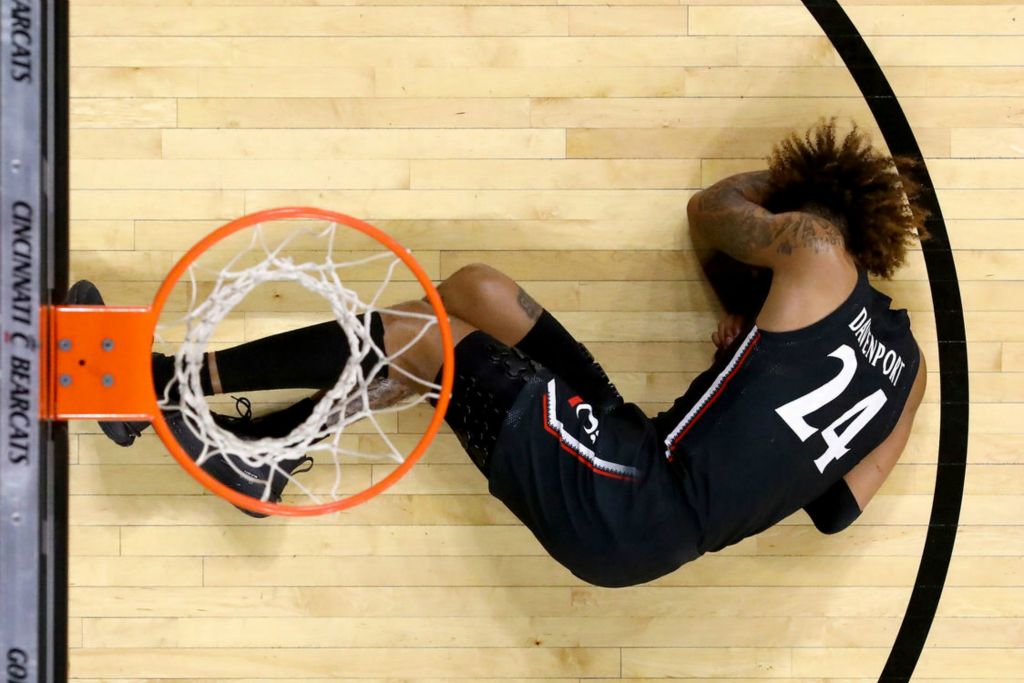 Sports Feature - 2nd place - Cincinnati Bearcats guard Jeremiah Davenport (24) suffers an injury in the second half of a game against the Houston Cougars at Fifth Third Arena in Cincinnati.  (Kareem Elgazzar / The Cincinnati Enquirer)