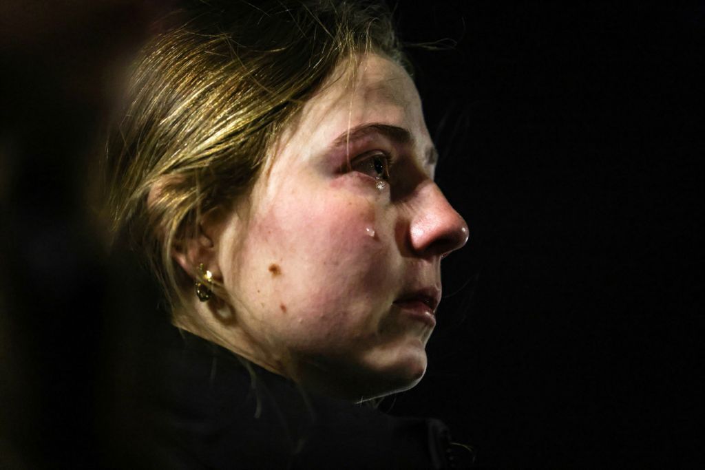 Story - 1st place - A tear falls down a girls face during a candle light vigil for students that were killed in a shooting, at the Diag at the University of Michigan in Ann Arbor. (Rebecca Benson / The Blade)