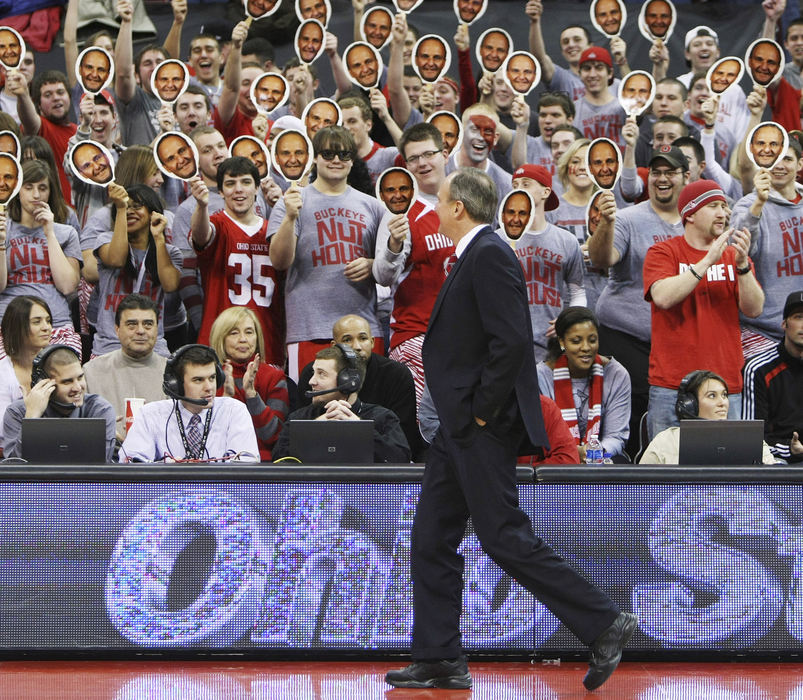 Feature - 3rd place - Ohio State Buckeyes head basketball coach reacts to the student section as they wave cutouts of Matta's likeness just prior to the NCAA basketball game against Penn State at Value City Arena. (Neal C. Lauron / The Columbus Dispatch)