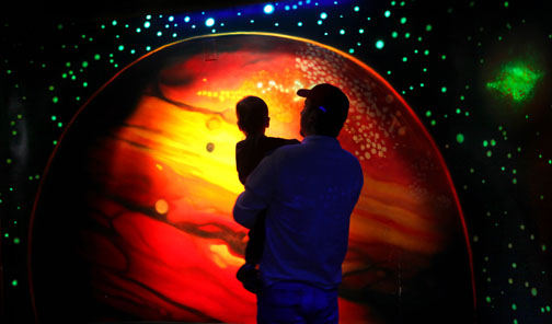 Feature - HM - North Ridgeville resident Mike Vrbancic and his 18-month-old son, Luca, ventured into the planetarium at the Lake Erie Nature & Science Center in Bay Village.  (Lynn Ischay / The Plain Dealer)