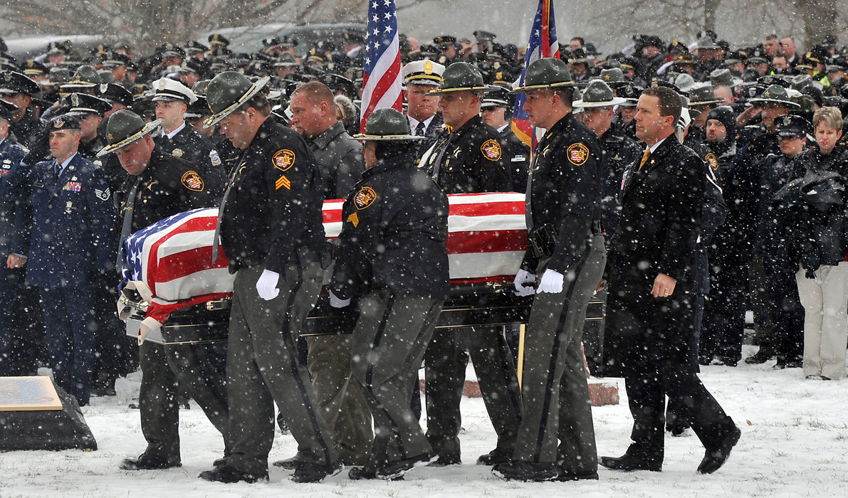 General News - 1st place - The flag draped casket of Clark County Sheriff's Deputy Suzanne Waughtel Hopper is carried to the grave site at Myers Cemetery as hundreds of law enforcement officers stand at attention. (Bill Lackey / Springfield News-Sun)