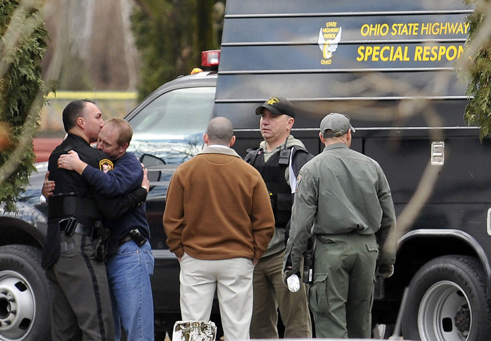 Spot News - 2nd place - Scenes from Enon Beach where two police officers and a suspect were shot in a shootout New Years Day. (Bill Lackey / Springfield News-Sun)