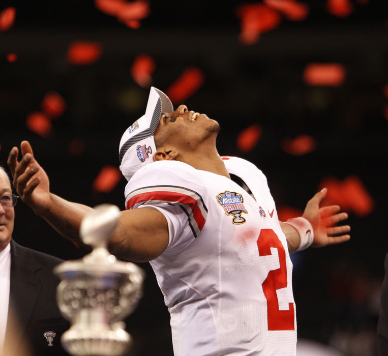 Sports - 1st place - Pryor looks at the confetti falling after the Buckeyes won the  Sugar Bowl in New Orleans on January 4, 2011.  (Columbus Dispatch photo by Fred Squillante) (FRED SQUILLANTE / FRED SQUILLANTE)