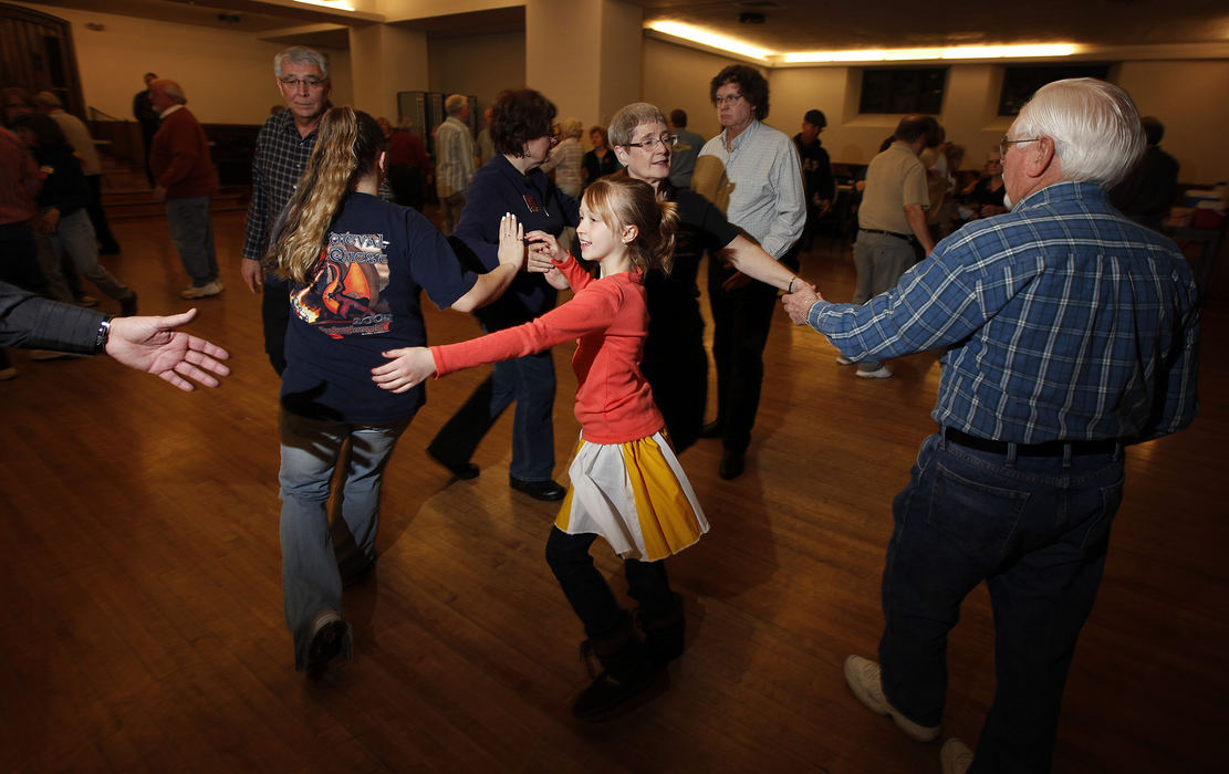 Story - 3rd place - Eleven-year-old Haley Nesser of Columbus square dances during a lesson with the Bucks and Does Singles Western Square Dance Club. (Jonathan Quilter / The Columbus Dispatch)