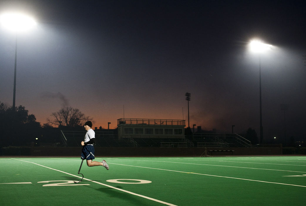 Story - 1st placeCadet Matt Pirrello, 21, takes a breath before beginning a sprint at Pruitt Field on Ohio University campus in Athens. Pirrello lost his right leg due to an accident that occurred during his R.O.T.C. training,  despite his injury he continues to train alongside his peers and hopes to someday serve in the United States Air Force.   (Brooke LaValley / The Columbus Dispatch)