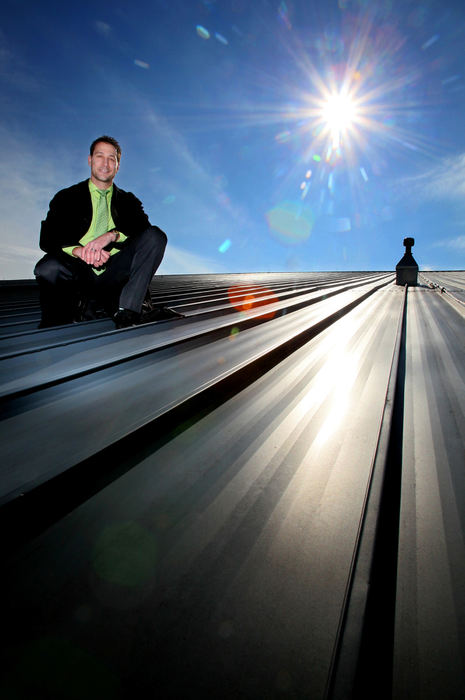 Portrait - HMUniversity of Akron manager of sustainability Ralph Morrone on the roof of the Lois and Freda Stile Athletic Field House where solar panels will be installed.  (Phil Masturzo / Akron Beacon Journal)