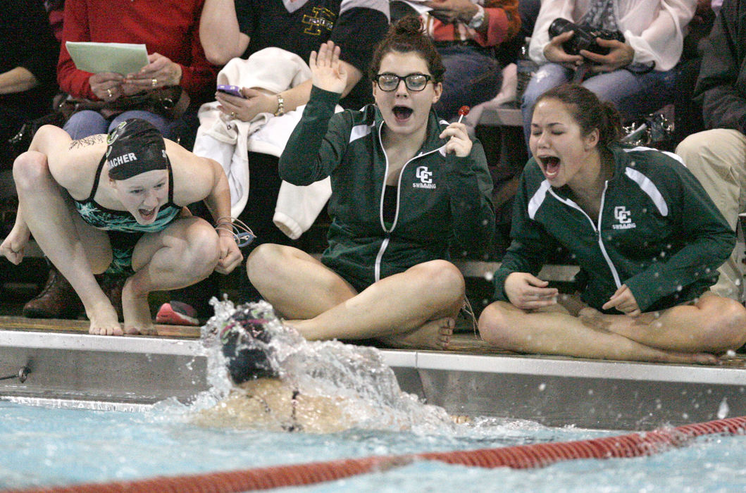 Sports Feature - 2nd placeCentral Catholic girls cheer on a teammate during their duel meet against Perry.  (Scott Heckel / The Repository)