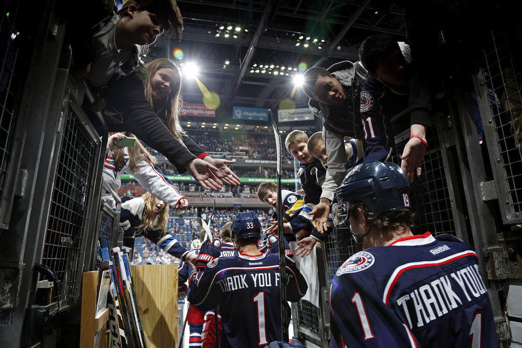 Sports Feature - 3rd placeAll wearing warm-up jerseys that say "Thank You Fans," the Columbus Blue Jackets take the ice before the first period of the NHL home opener at Nationwide Arena in Columbus. The NHL lockout of the 2012 - 13 season resulted in a short 48 game schedule with 510 regular season games cancelled before the agreement in January.   (Eamon Queeney / The Columbus Dispatch)