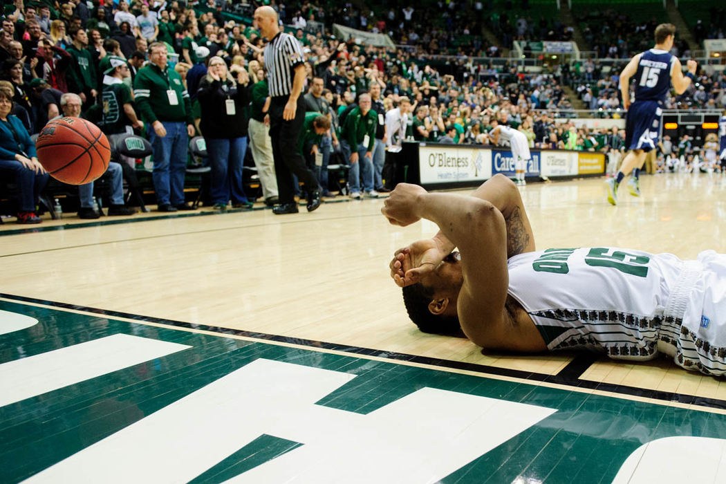 Sports Feature - HM - Ohio guard Nick Kellogg reacts after missing the what would be tying shot after the Akron Zips defeated the Ohio Bobcats 83-80 in double overtime at the Convo.   (Daniel Kubus / Ohio University)