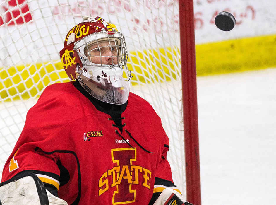 Sports - HM - Iowa State University freshman goalie, Peter Alexander, stares at the puck in anticipation as it rockets towards him. The Bobcats defeated the Cyclones 4-2 at Bird Arena.  (Isaac Hale / Ohio University (The Post))